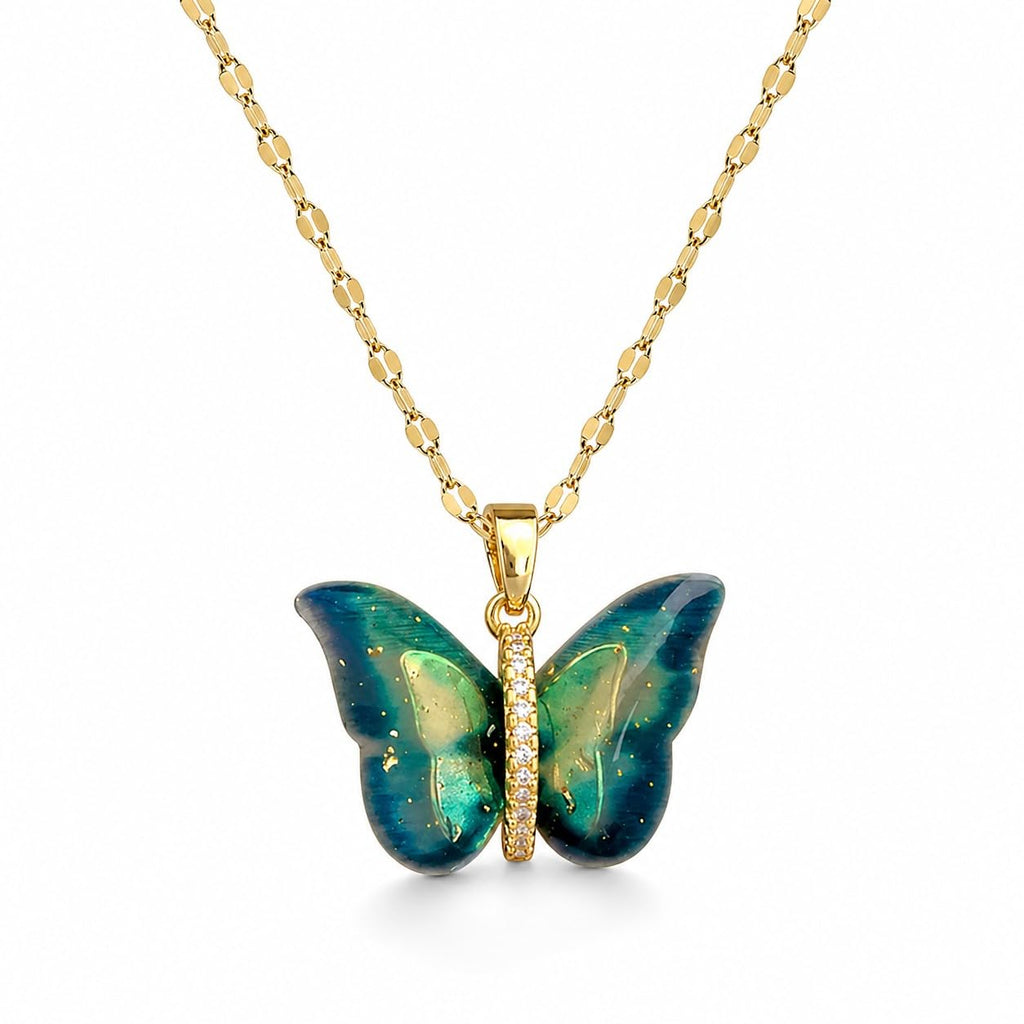Butterfly-shaped pendant with gold chain on a white background